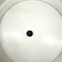 Minimalist white surface with black dot, red wire; potential electronic device component.