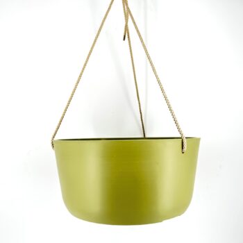 Olive green hanging planter with braided rope and minimalist design on white background.