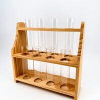 Wooden propagation station with four clear glass test tubes for houseplant cuttings