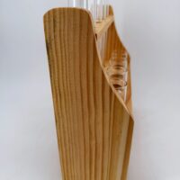 Side view of wooden propagation station with clear glass tubes and natural wood finish