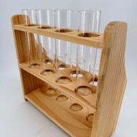 Close up of wooden test tube propagation station showing glass tubes and natural timber frame